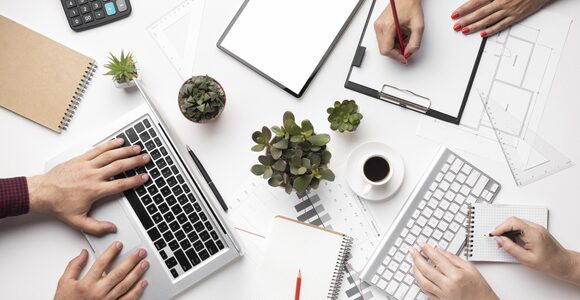 flat-lay-office-desk-assortment-with-empty-screen-tablet